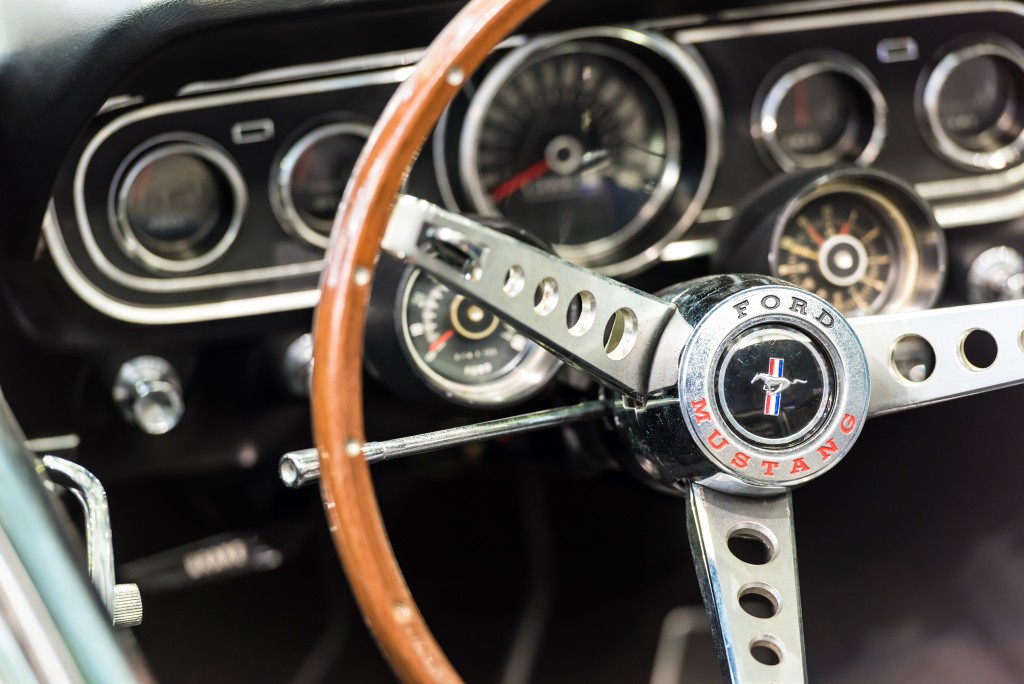 vintage car steering wheel and gauge cluster